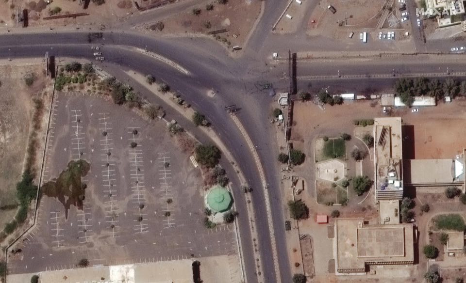 This satellite image provided by Maxar Technologies shows a tank and other military vehicles blocking a road near white nile in Khartoum, Sudan, Monday April 17, 2023. The Sudanese military and a powerful paramilitary group are battling for control of the chaos-stricken nation for a third day. (Satellite image ©2023 Maxar Technologies via AP)