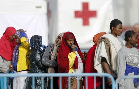 Migrants disembark from British warship HMS Bulwark at Catania harbour, Italy, May 14, 2015. REUTERS/Antonio Parrinello