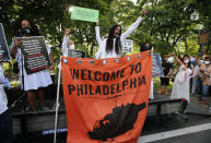 MOVE member Mike Africa speaks during a rally for the 36th anniversary of the MOVE bombing at Osage Avenue and Cobbs Creek Parkway in Philadelphia on Thursday, May 13, 2021. In 1985, the police bombed the group’s headquarters, igniting fuel for a generator and spread to more than 60 rowhomes, killing 11 people including five children. (Yong Kim/The Philadelphia Inquirer via AP)