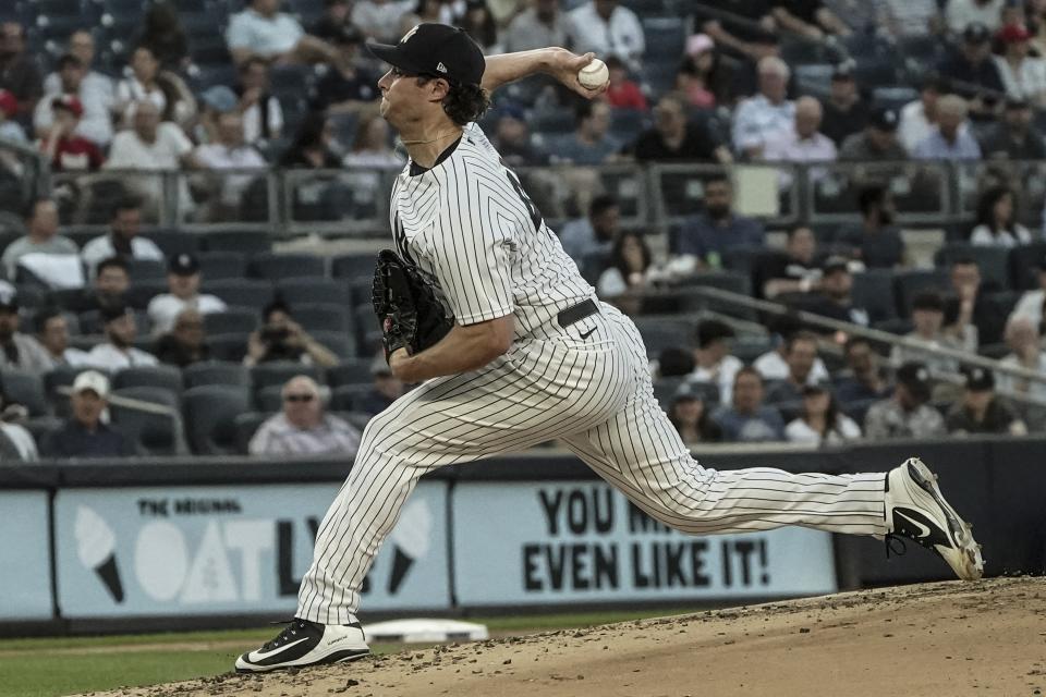 New York Yankees pitcher Gerrit Cole (45) throws a strike in the second inning of a game against the Tampa Bay Rays, Tuesday June 14, 2022, in New York. (AP Photo/Bebeto Matthews)