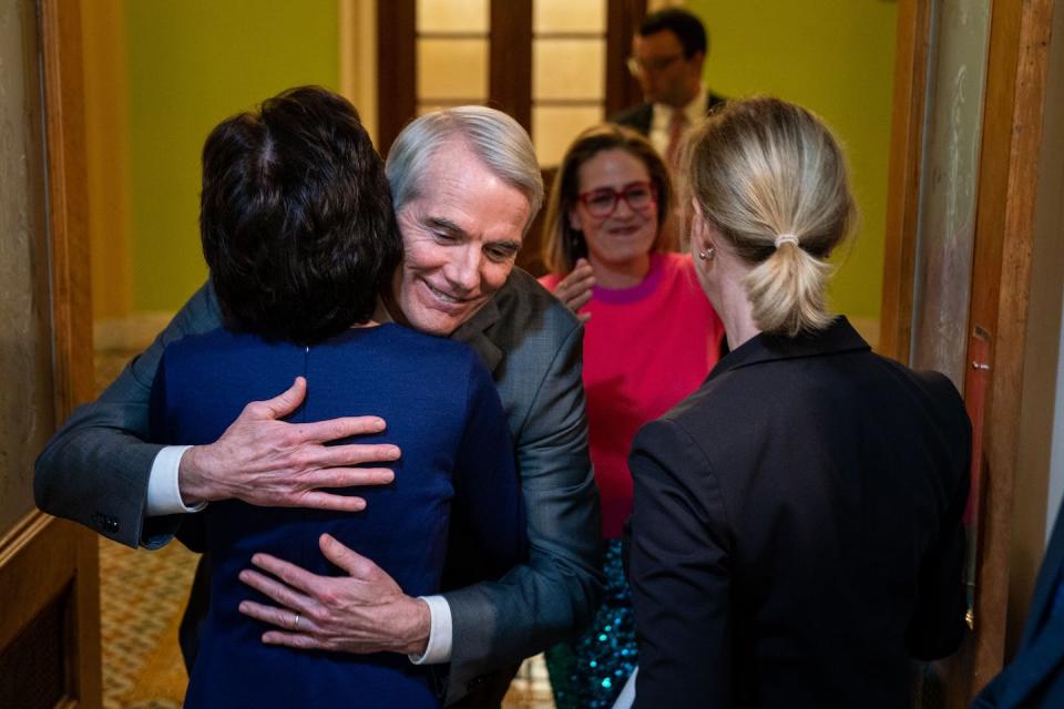 Several lawmakers celebrate after the Senate voted to approve the Respect for Marriage Act on Nov. 29, 2022. <a href="https://media.gettyimages.com/id/1245218619/photo/senate-passes-respect-for-marriage-act.jpg?s=1024x1024&w=gi&k=20&c=vy_UtS3LVbG_yTV3KN4UvXIA3dOxGxuwXwOLzBv3Fpc=" rel="nofollow noopener" target="_blank" data-ylk="slk:Kent Nishimura/Los Angeles Times via Getty Images;elm:context_link;itc:0;sec:content-canvas" class="link ">Kent Nishimura/Los Angeles Times via Getty Images</a>