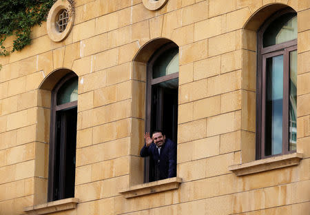 Saad al-Hariri who suspended his decision to resign as prime minister gestures to his supporters at his home in Beirut, Lebanon November 22, 2017. REUTERS/Jamal Saidi