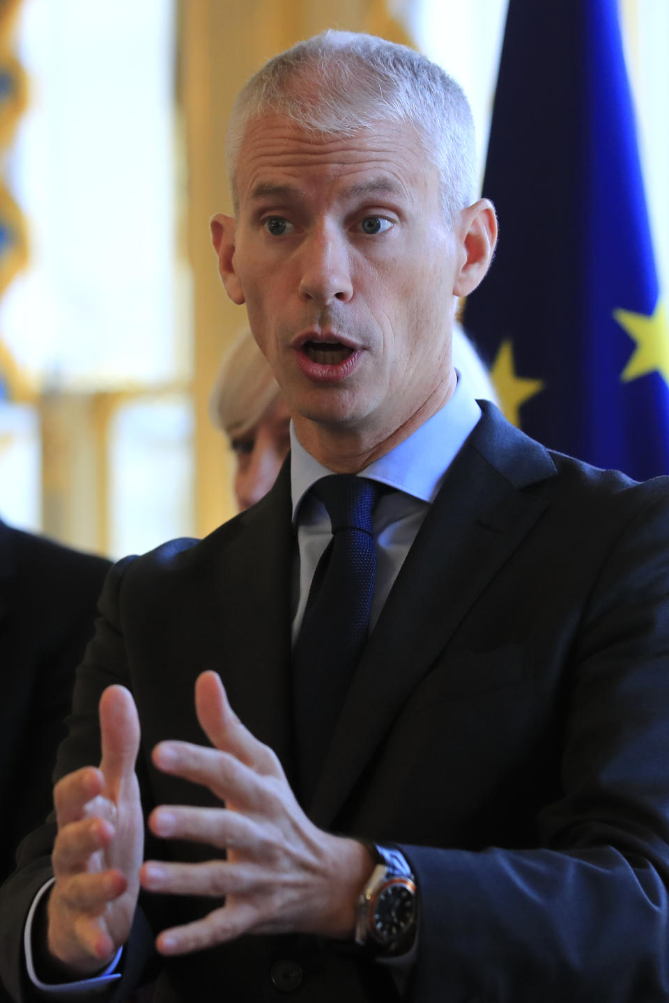 French Culture Minister Franck Riester speaks six months after a fire broke at the Notre Dame cathedral, Tuesday, Oct. 15, 2019 in Paris. Franck Riester says the melted, twisted scaffolding atop Notre Dame Cathedral will be removed "in coming weeks" to allow restoration work to begin. It's been six months since fire gutted the medieval structure, which was under renovation at the time and crisscrossed with scaffolding where the spire once stood.(AP Photo/Michel Euler)