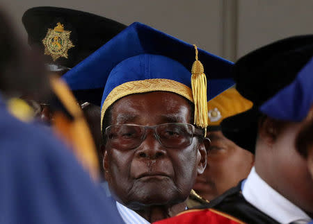 Zimbabwe President Robert Mugabe attends a university graduation ceremony in Harare, Zimbabwe, November 17, 2017. REUTERS/Philimon Bulawayo