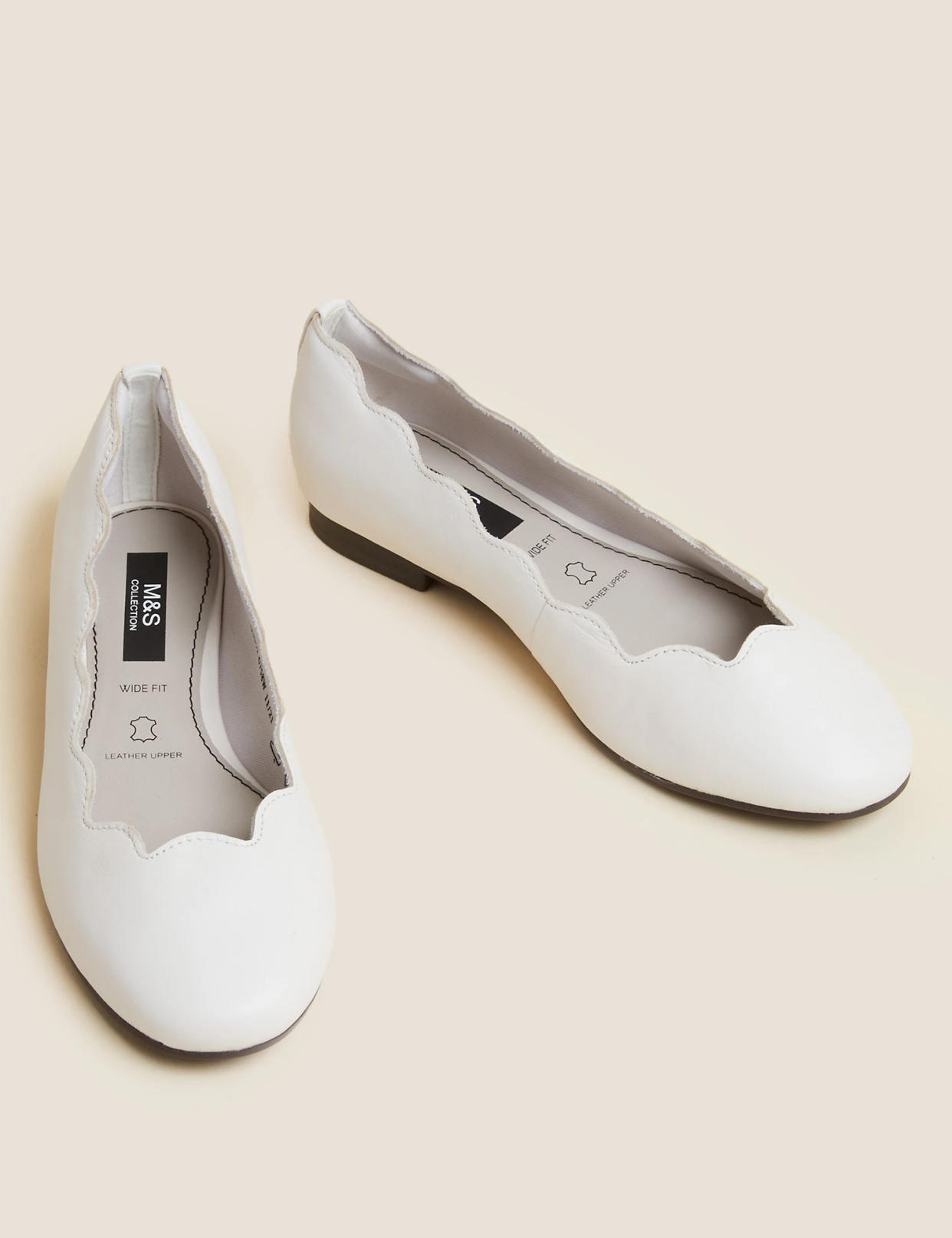 These pretty pumps with scalloped edges also come in black. (M&S)