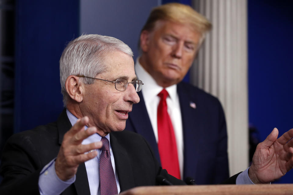 FILE - In this April 22, 2020 file photo, President Donald Trump watches as Dr. Anthony Fauci, director of the National Institute of Allergy and Infectious Diseases, speaks about the coronavirus in the James Brady Press Briefing Room of the White House in Washington. (AP Photo/Alex Brandon)