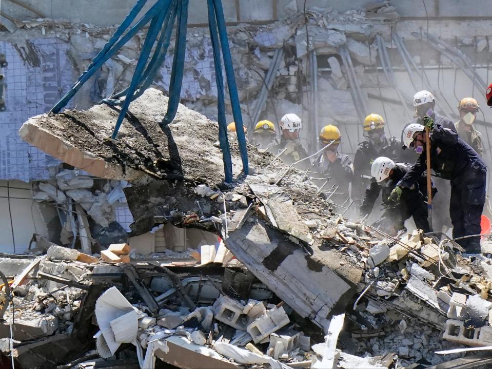 Crews work in the rubble at the Champlain Towers South (AP)