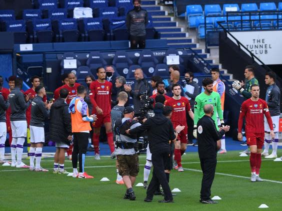 Liverpool players walk through the guard of honour (POOL/AFP via Getty Images)