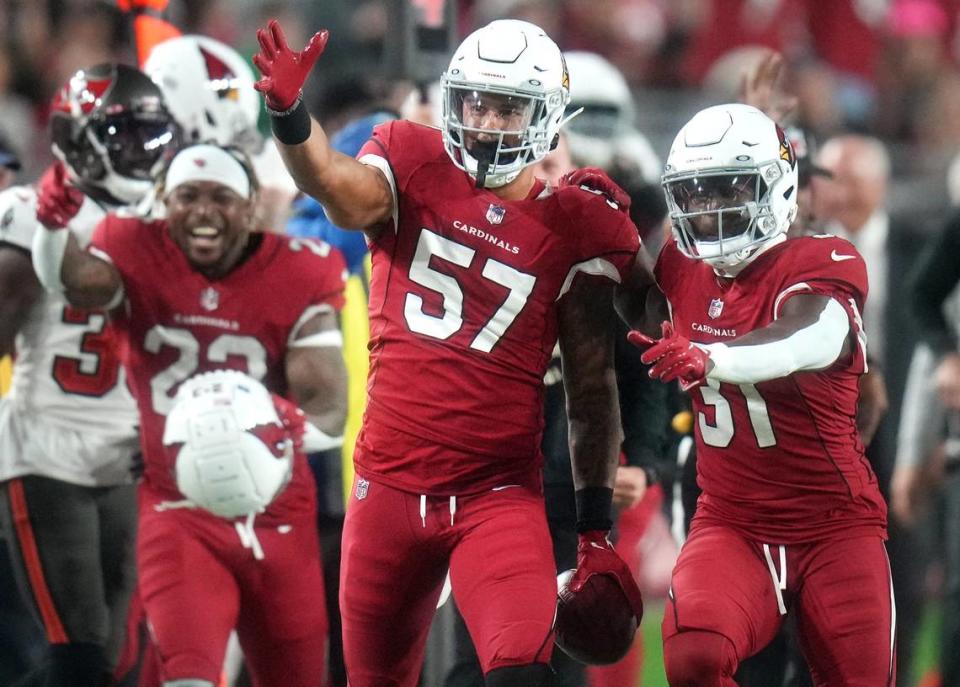 Arizona Cardinals special teams player Kamu Grugier-Hill (57) celebrates his first down catch on a fake punt against the Tampa Bay Buccaneers at State Farm Stadium.
