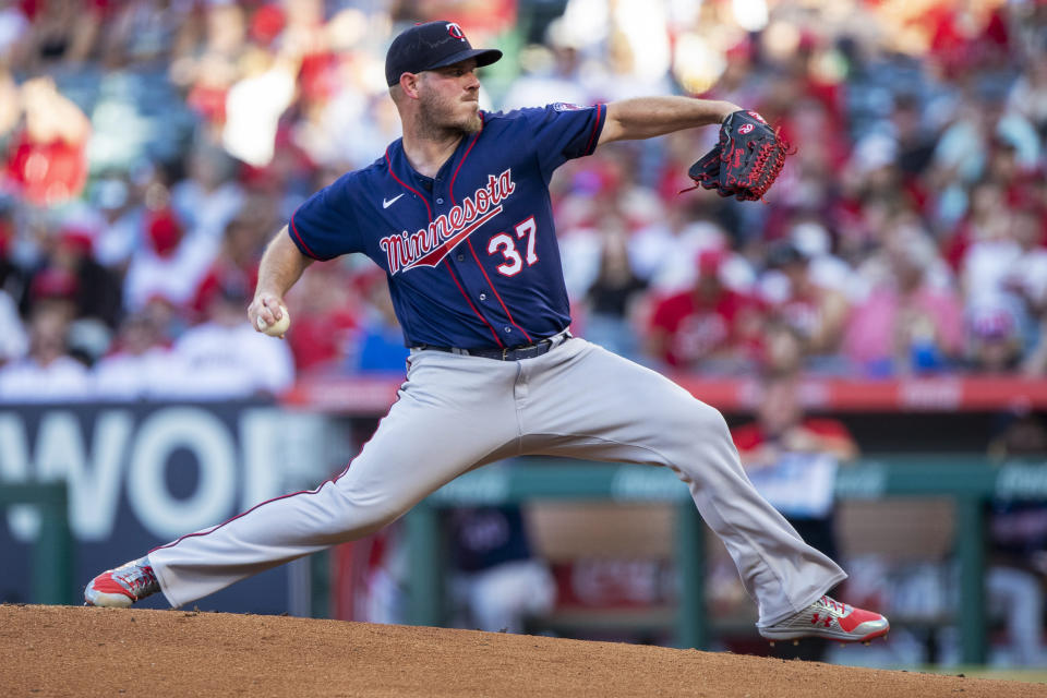 Minnesota Twins starting pitcher Dylan Bundy throws to a Los Angeles Angels batter during the first inning of a baseball game in Anaheim, Calif., Saturday, Aug. 13, 2022. (AP Photo/Alex Gallardo)