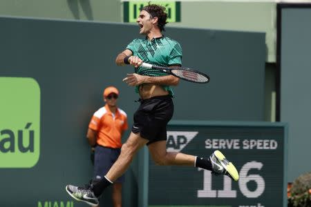 Apr 2, 2017; Key Biscayne, FL, USA; Roger Federer of Switzerland celebrates after winning match point against Rafael Nadal of Spain (not pictured) in the men's singles championship of the 2017 Miami Open at Crandon Park Tennis Center. Mandatory Credit: Geoff Burke-USA TODAY Sports