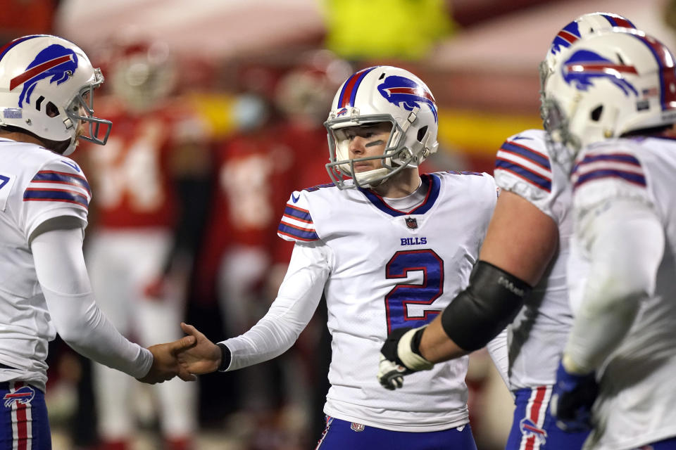 Buffalo Bills place kicker Tyler Bass (2) celebrates with teammates after kicking a 20-yard field goal during the first half of the AFC championship NFL football game against the Kansas City Chiefs, Sunday, Jan. 24, 2021, in Kansas City, Mo. (AP Photo/Charlie Riedel)