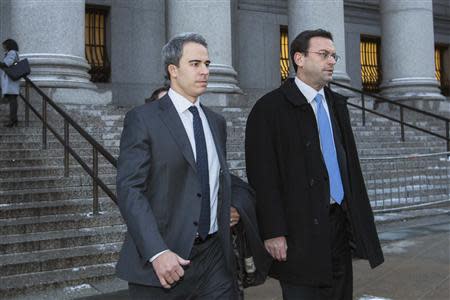 Michael Steinberg (L), a top portfolio manager at Steven A. Cohen's SAC Capital Advisors hedge fund, departs Federal Court in Manhattan after being found guilty on charges that he traded on insider information in New York December 18, 2013. REUTERS/Lucas Jackson