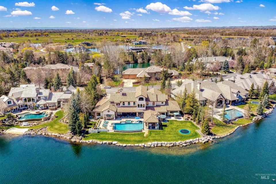 The $6.4 million home sits next to a human-made lake in the Two Rivers neighborhood.