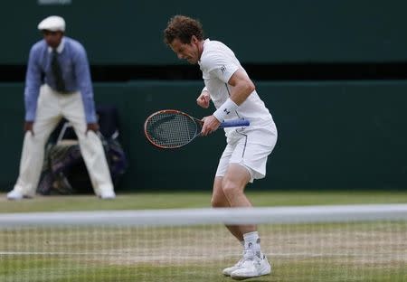 Andy Murray of Britain celebrates after winning his match against Andreas Seppi of Italy at the Wimbledon Tennis Championships in London, July 4, 2015. REUTERS/Suzanne Plunkett