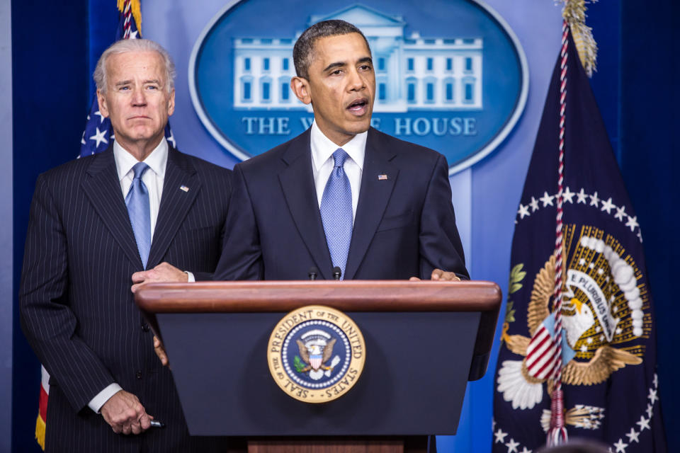 Obama, right, speaks as Biden looks on in the Brady Press Briefing Room at the White House on Jan. 1, 2013.&nbsp;