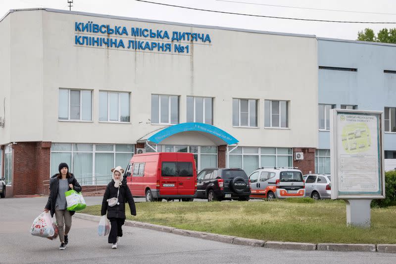 People evacuate hospital after authorities declare possible danger of Russian strike, in Kyiv