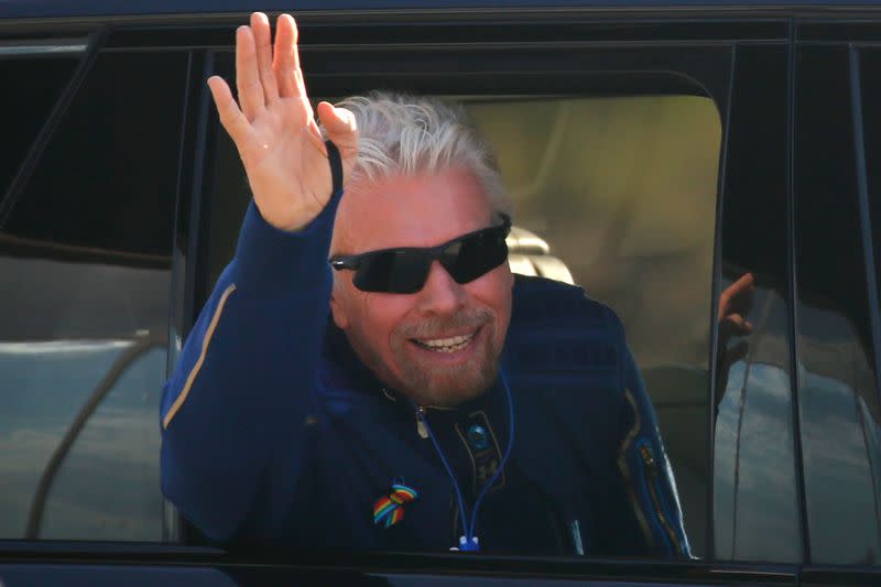 Billionaire entrepreneur Richard Branson departs with his crew prior to boarding at Spaceport America