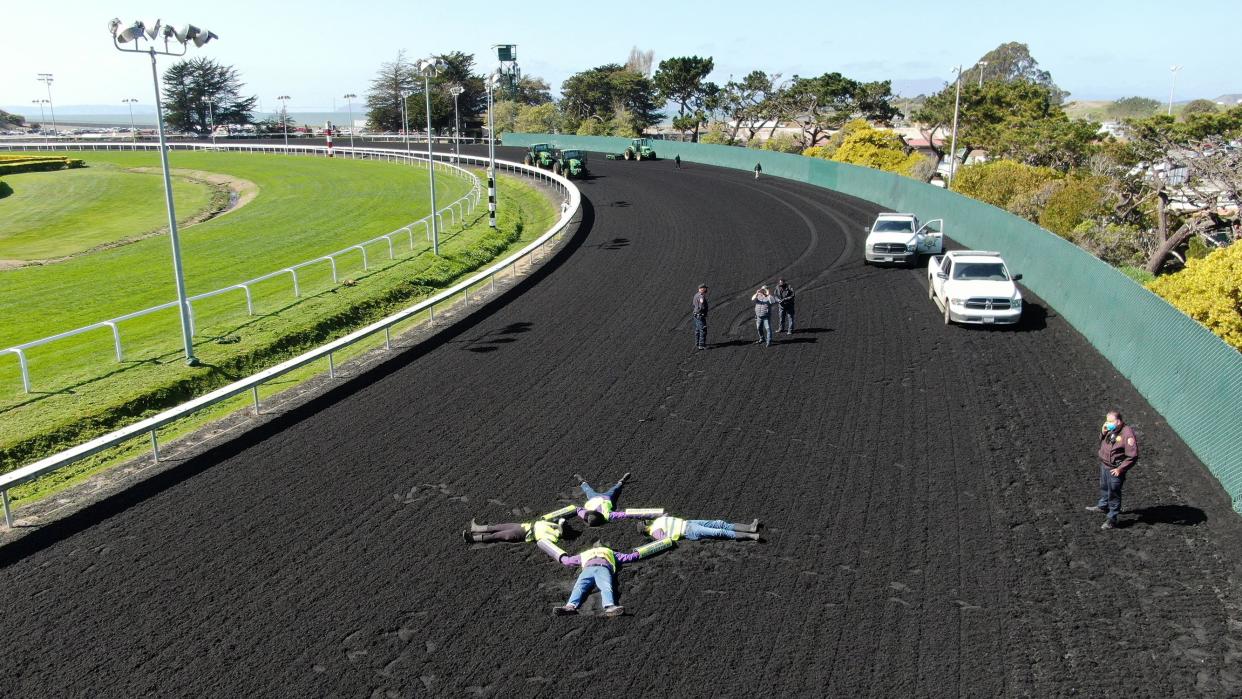 Four animal rights activists lay locked together on the track at Golden Gate Fields in Berkeley, Calif.