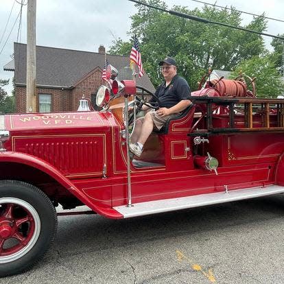 Chief Tim Schnitker driving Woodville's first fire truck in a past Grand Parade.