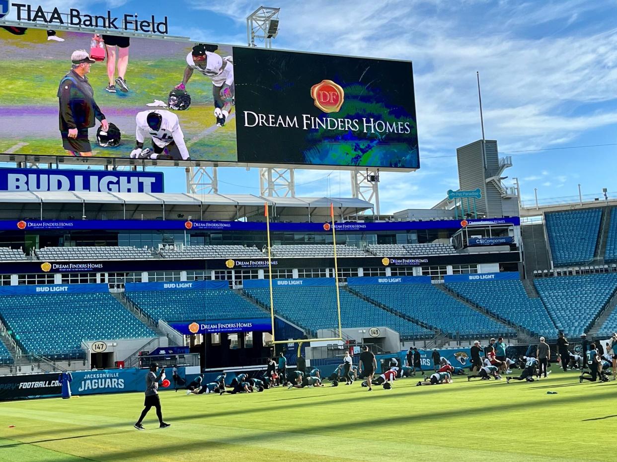 Jaguars coach Doug Pederson watches his players warm up before Monday's training camp practice at TIAA Bank Field.