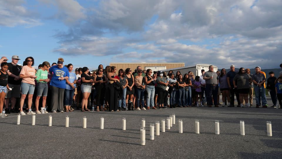 Candles are set out in the shape of a cross where almost 200 people gathered for a candlelight vigil on Thursday for the Erwin, Tennessee, flood victims. - Saul Young/News Sentinel/USA Today Network/Imagn Images