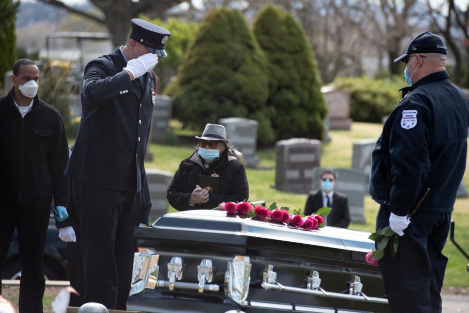 Passaic firefighter Israel Tolentino, 33 who passed away from complications of COVID-19, was laid to rest at East RidgeLawn Cemetery on Thursday, April 2, 2020. Passaic firefighter Rubio Alfaro salutes the casket of his best friend Israel Tolentino. 