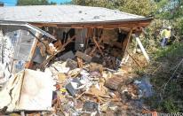 Three homes were damaged when a military plane crashed in a Lake Worth neighborhood on Sept. 19, 2021.