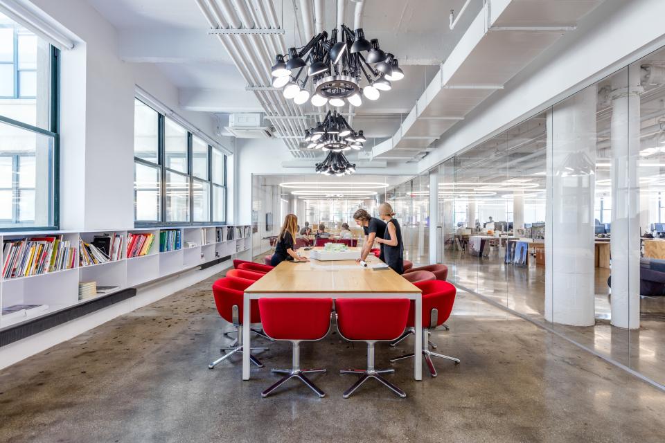 Each conference room is furnished with Scoop chairs designed by BIG for Halle. “The color of the chairs designates the room,” says Bergmann. The red conference room is the largest and features lighting by Mooi.