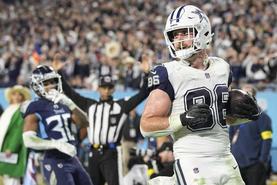 Dallas Cowboys tight end Dalton Schultz (86) runs into the end zone after a catch for a touchdown against Tennessee Titans cornerback Tre Avery (30) during the second half of an NFL football game, Thursday, Dec. 29, 2022, in Nashville, Tenn. (AP Photo/Chris Carlson)