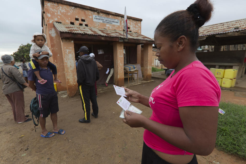 People wait for a polling station to open in the presidential elections in Antananarivo, Madagascar Thursday, Nov. 16, 2023. Madagascar's President Andry Rajoelina is pushing ahead with a presidential election Thursday, that could give him a third term, even as opposition protests roil the country and the majority of candidates have announced a boycott. (AP Photo/Alexander Joe)