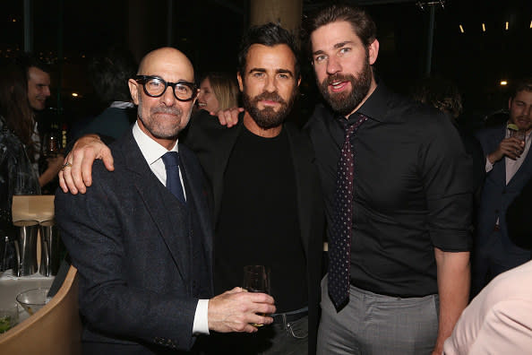 Stanley and John standing with Justin Theroux with their arms on each other's shoulder