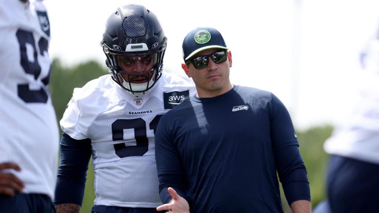 <div>RENTON, WASHINGTON - MAY 03: Byron Murphy II #91 of the Seattle Seahawks talks with head coach Mike Macdonald during Seattle Seahawks rookie minicamp at Virginia Mason Athletic Center on May 03, 2024 in Renton, Washington.</div> <strong>(Steph Chambers / Getty Images)</strong>