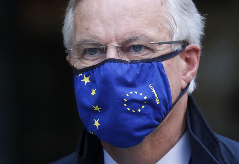 European Commission's Head of Task Force for Relations with the United Kingdom, Michel Barnier wearing a face mask bearing the slogan 'EU solidarity' as he walks from his hotel to the Conference Centre in London, Thursday, Nov. 12, 2020. With less than two months to go before the U.K. exits the EU's economic orbit, trade deal talks continue in London. (AP Photo/Frank Augstein)