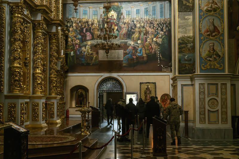 Ukrainian law enforcement officers inspect one of churches of the Kyiv Pechersk Lavra monastery in Kyiv