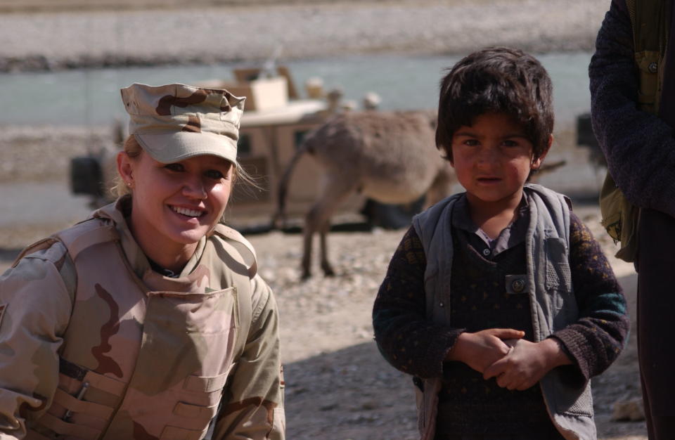 Marti Ribeiro and an Afghan boy in 2006.
