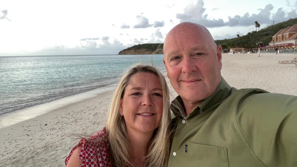 Lee and his wife pictured on a Thai beach.