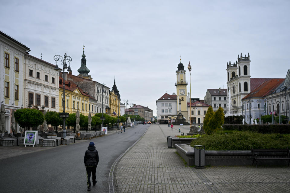 People walk in Banska Bystrica, central Slovakia, Friday, May 17, 2024. When a gunman shot Slovak Prime Minister Robert Fico this week, shock rippled across the Central European country — even though the pro-Russia leader himself warned that the country was so divided that an assassination attempt was possible. (AP Photo/Denes Erdos)