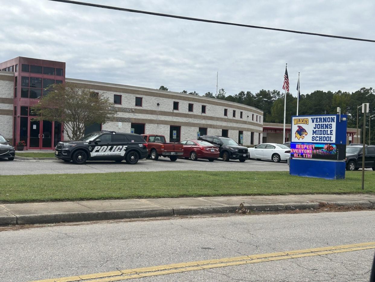 A Petersburg Police vehicle parks in front of Vernon Johns Middle School in Petersburg Monday, Sept. 25, 2023. This school and the adjacent Petersburg High School were targeted in an online violent threat over the weekend, prompting heightened police presence at both schools.