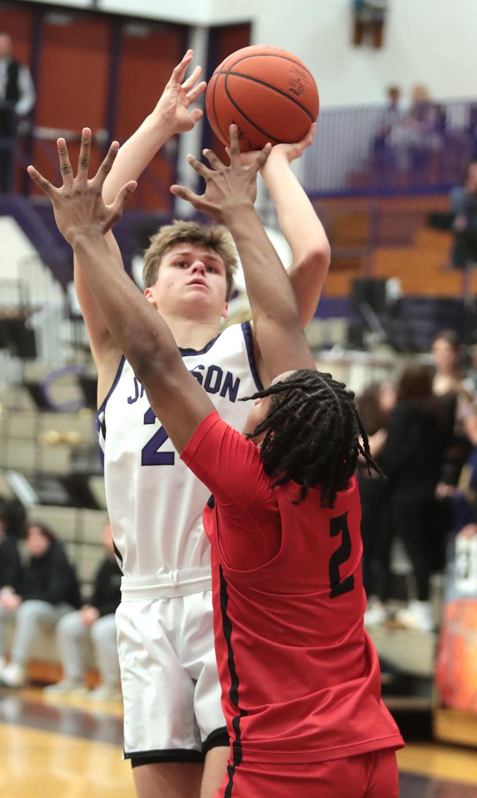 Jackson's Kyle Monterrubio shoots a jumper over defense from McKinley's Dante McClellan in the second half at Jackson Tuesday, January 10, 2023. 