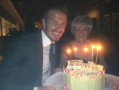 Celebrity photos: David Beckham celebrated his birthday this week, and his mum flew out to America for the occasion. Victoria tweeted this cute pic of the pair as he tucked into his birthday cake.