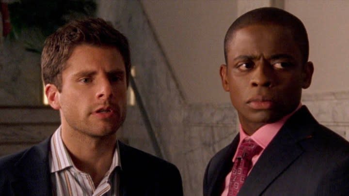 Two men from Psych looking intently at something.