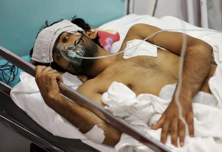 A wounded Afghan man, who survived a U.S. air strike on a Medecins Sans Frontieres (MSF) hospital in Kunduz, receives treatment at the Emergency Hospital in Kabul October 8, 2015. REUTERS/Mohammad Ismail