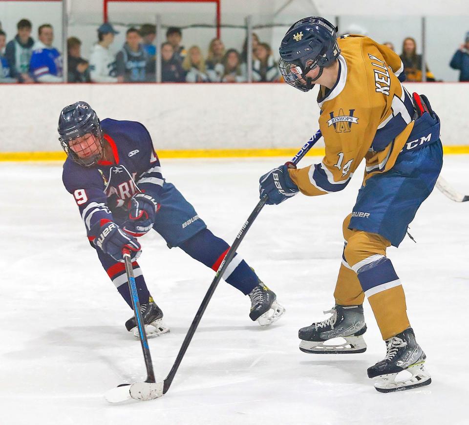 Finn Kelly tries to get the puck from LS #19 Brett Martin.Archbishop Williams host Lincoln Sudbury in MIAA boys hockey action at the Canton Sportsplex on Wednesday March 1, 2023 