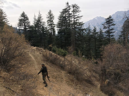 An Afghan security force personnel patrols near his check post in Parun, capital of Nuristan province, Afghanistan November 20, 2016. REUTERS/Hamid Shalizi