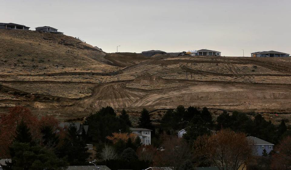 Outlines of new roads and residential lots are being scratched out of the dirt on the west end of the north face of Thompson Hill in Kennewick.