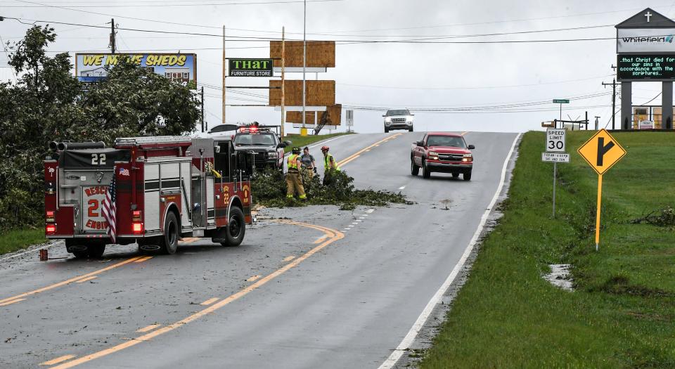 Whitefield Fire Station of Anderson County remove a fallen tree from US 29 near the Jockey Lot, during Tropical Storm Helene in Williamston, S.C. Friday, September 27, 2024.