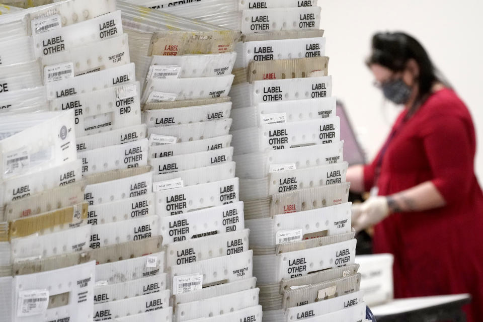 Stacks of ballots await to be counted for the general election inside the Maricopa County Recorder's Office, Friday, Nov. 6, 2020, in Phoenix. (AP Photo/Matt York)