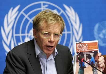 World Health Organization (WHO) Assistant Director General Bruce Aylward holds a report during a news conference on Ebola at the United Nations in Geneva September 16, 2014. The Ebola outbreak in West Africa has killed 2,461 people, half of the 4,985 infected by the virus, Aylward said on Tuesday. REUTERS/Denis Balibouse