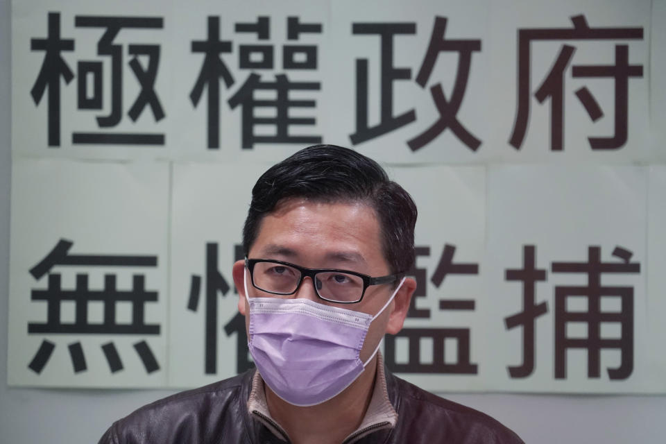 Former Democratic Party legislator Lam Cheuk-ting speaks during a press conference after being released on bail, in Hong Kong, Friday, Jan. 8, 2021. Some former Hong Kong legislators and pro-democracy activists were released on bail late Thursday after being arrested under Hong Kong's national security law as part of Wednesday's mass arrests of 53 people. The Chinese in the background reads "Totalitarian government, fearless of indiscriminate arrest." (AP Photo/Kin Cheung)